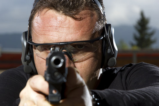 Man shooting  on an outdoor shooting range