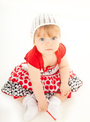 studio shot of blond little baby girl