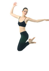 Fototapeta na wymiar Young girl in black sportwear jumping