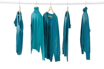 Blue clothing on hanger in a row