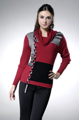 fashionable woman posing on light background