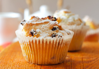 Sweet Muffins with tea on the table