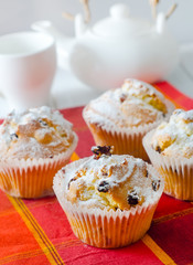Sweet Muffins with tea on the table