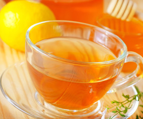 Fresh tea with lemon in the glass cup