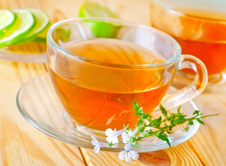 Fresh tea with lemon in the glass cup