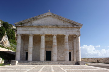 classic Greek stone marble carved Temple architecture with ionic pillars and columns on the island of Corfu Greece	