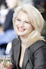 Woman relaxing in wine bar