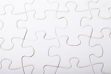Jigsaw puzzle with blank white pieces