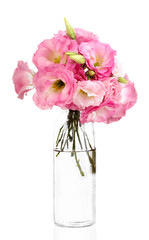 bouquet of eustoma flowers in bottle, isolated on white