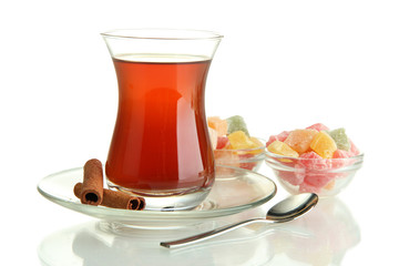 glass of Turkish tea and rahat Delight, isolated on white