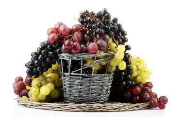 assortment of ripe sweet grapes in basket, isolated on white.