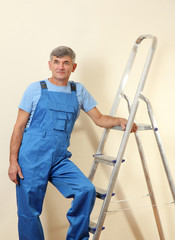 Handyman in house near the wall