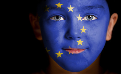 Portrait of a child with a painted EU flag