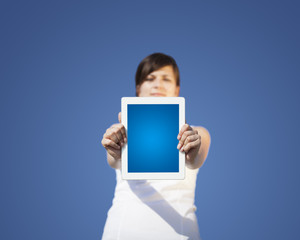 Young woman looking at modern tablet
