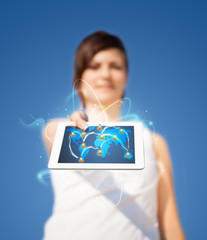 Young woman looking at modern tablet with abstract lights and so