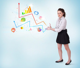Young business woman presenting colorful charts and diagrams