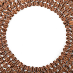 Coffee beans spread in circle on white background