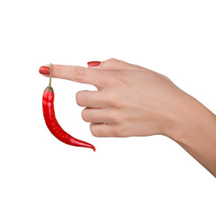 Chili pepper hanging on womans finger , isolated on white