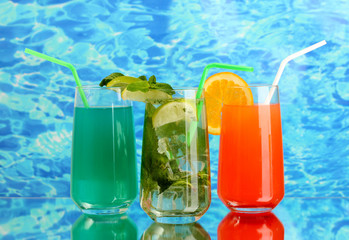 Three cocktails on blue background