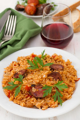 sausages with rice on the white plate