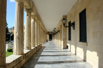 classical marble columns and pillars with shadows at Palace of St Michael and St George in corfu greece	