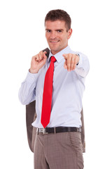 business man points holding jacket