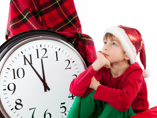 Baby in Santa Claus hat waiting for gift