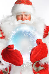 Traditional Santa Claus holding magic snowball Isolated on white