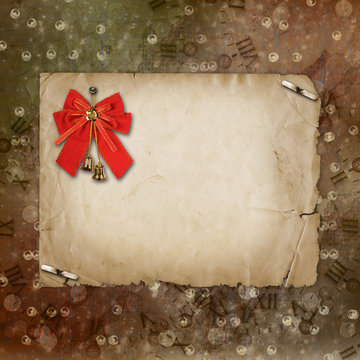 Christmas bells with red bow on the abstract background