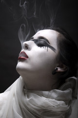 Vampire woman smoking