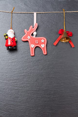 Christmas ornament: christmas bell, red reindeer and Santa Claus