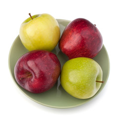 Apples pile on plate