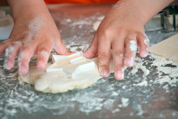 Close up of kid baking cookies