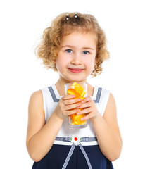 Portrait of little girl drinking orange juice
