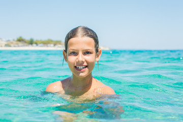 Young girl playing in the sea