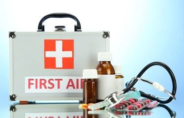 First aid box, on blue background