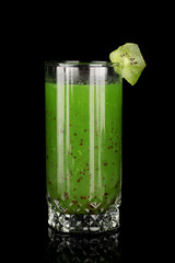 Green vegetable juice isolated on black