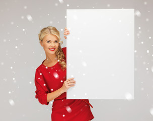 lovely woman in red dress with blank board