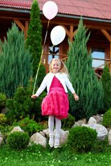 beautiful princess girl fly with balloons, green outdoors