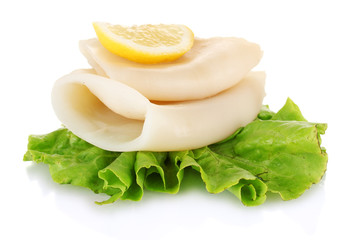 boiled squids with lettuce and lemon isolated on white