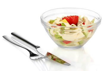 squid salad with vegetables in a glass bowl isolated on white
