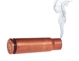 single cartridge case with smoke on white