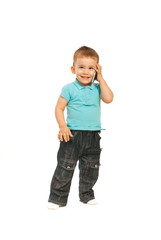 Happy toddler boy talking by phone