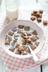 Crispy cereal and chocolate pillows with milk