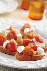 Crostinis with feta cheese and tomato