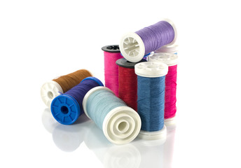 stack of coloured sewing thread