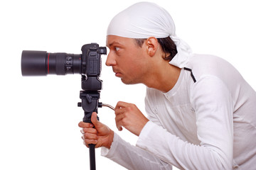 Portrait of handsome man posing on white background with camera