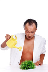 Portrait of handsome man posing on white background with waterin