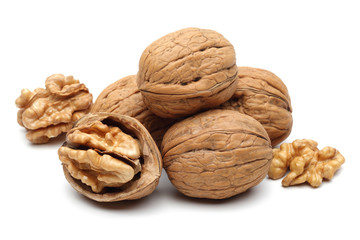 Heap of walnuts isolated on white background