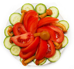 a salad of tomatoes, mushrooms and cucumbers